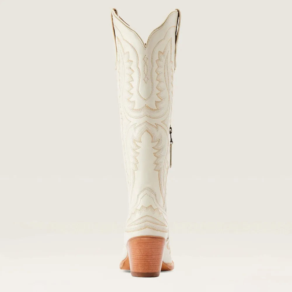 Bottes cowboy beiges brodées. Bout pointu, talon cubain, tirette latérale.