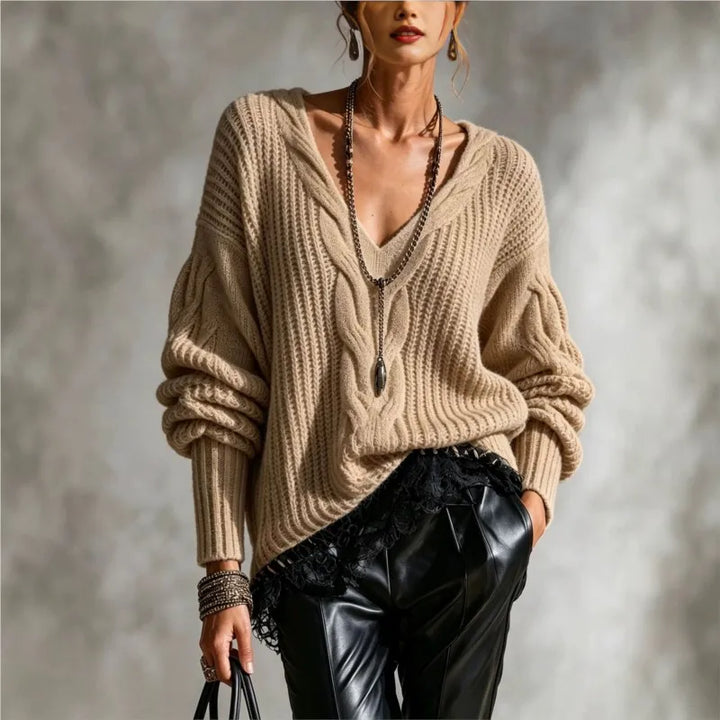 Woman wearing khaki cable knit V-neck sweater with balloon sleeves