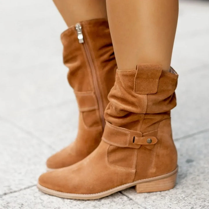 Harlow slouchy suede mid-calf boots in black, side view on model