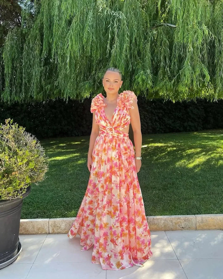 Robe maxi femme sans manches, en coton léger, avec un motif floral coloré et une coupe fluide parfaite pour l'été.
