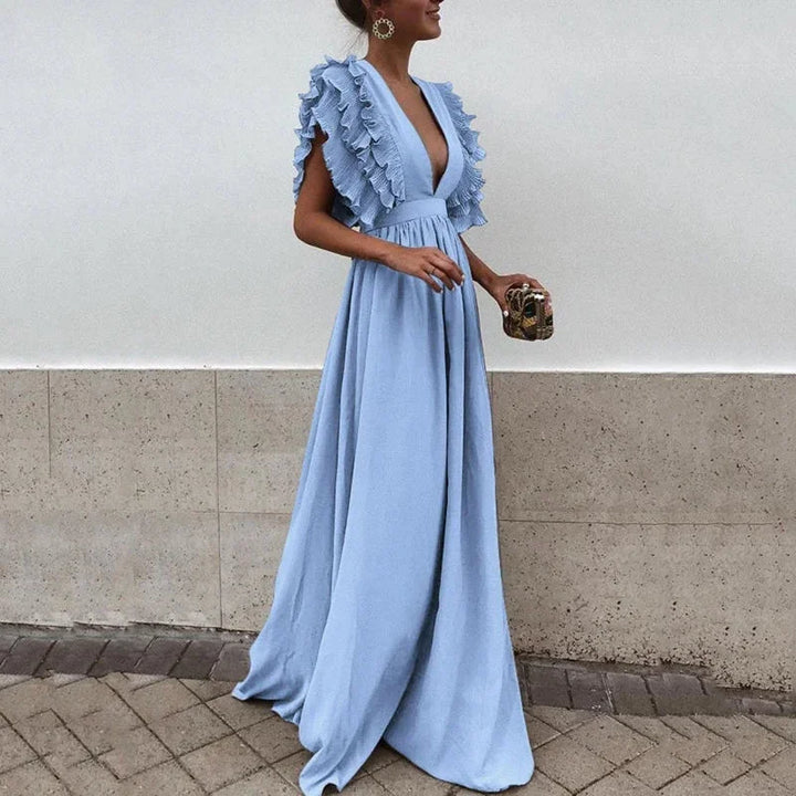 Robe longue femme en tissu fluide, manches volantées, décolleté plongeant, idéale pour un look décontracté et élégant.