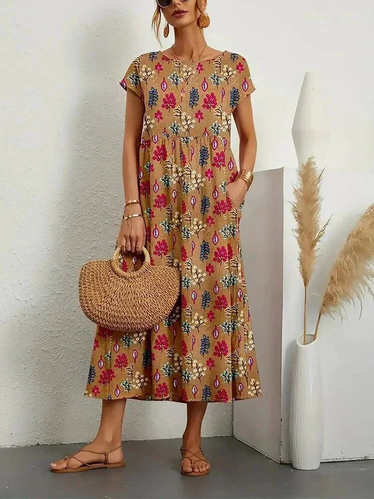 Robe midi en coton marron, imprimée de fleurs et dotée de poches pratiques pour un style décontracté et élégant.